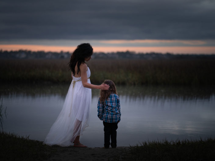 Portrait of a mother and son standing by the marsh at Wrightsville Beach captured by Wilmington, NC family photographer Salty Star Photography